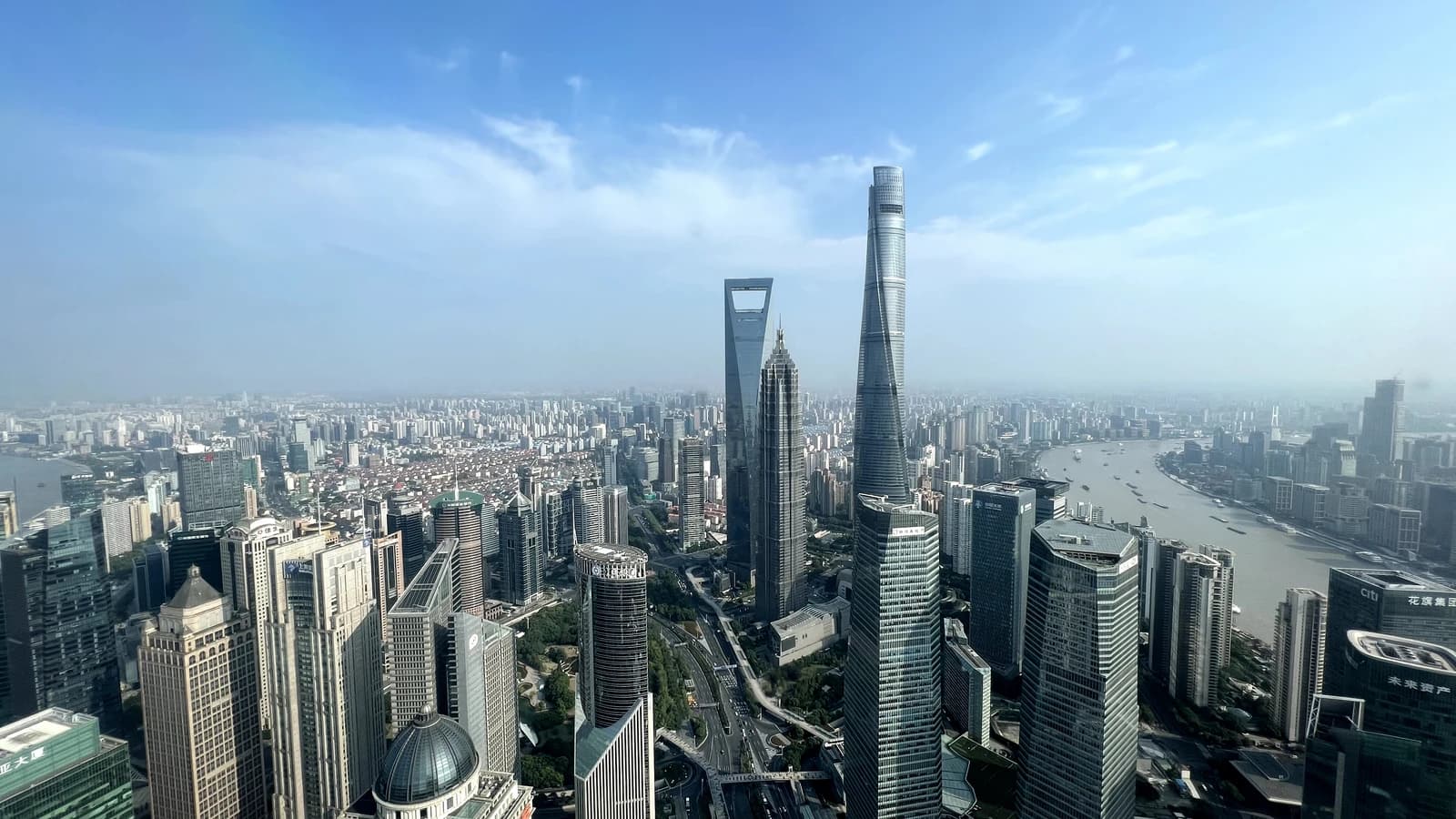 Aerial view of Shanghai's Lujiazui financial district with towering skyscrapers.