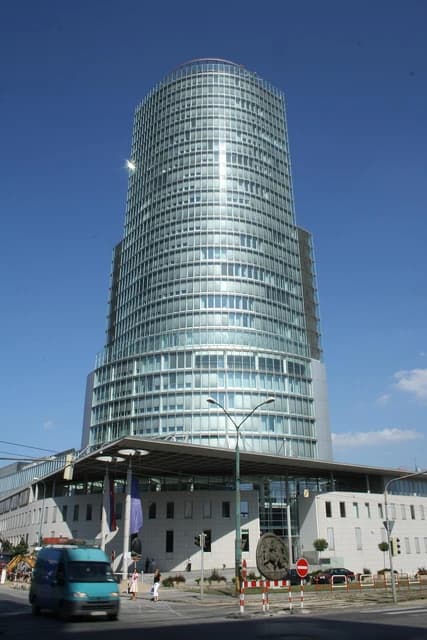 National Bank of Slovakia building in Bratislava, Slovakia, with a street in front.