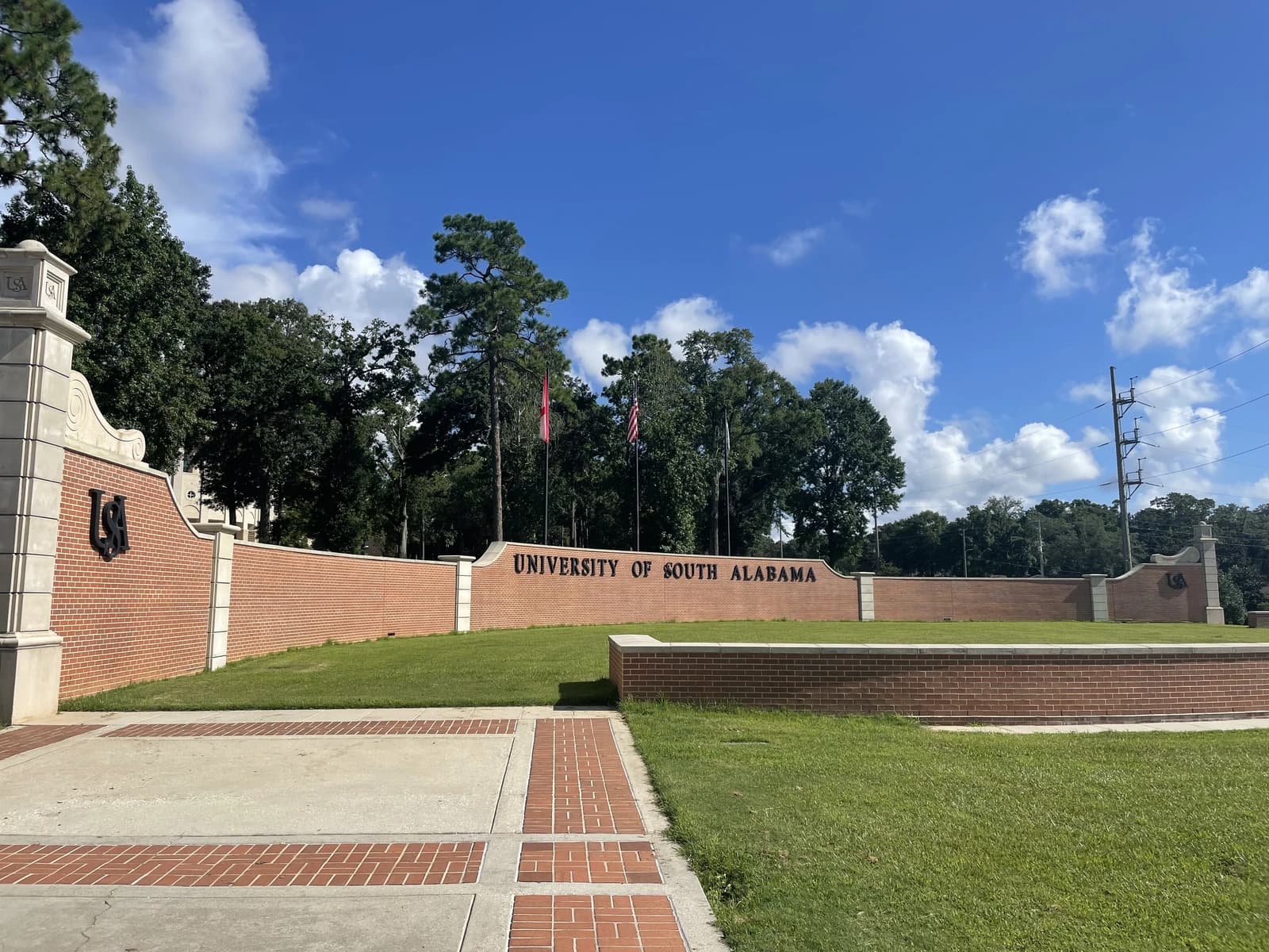 Entrance sign for the University of South Alabama on a clear day.