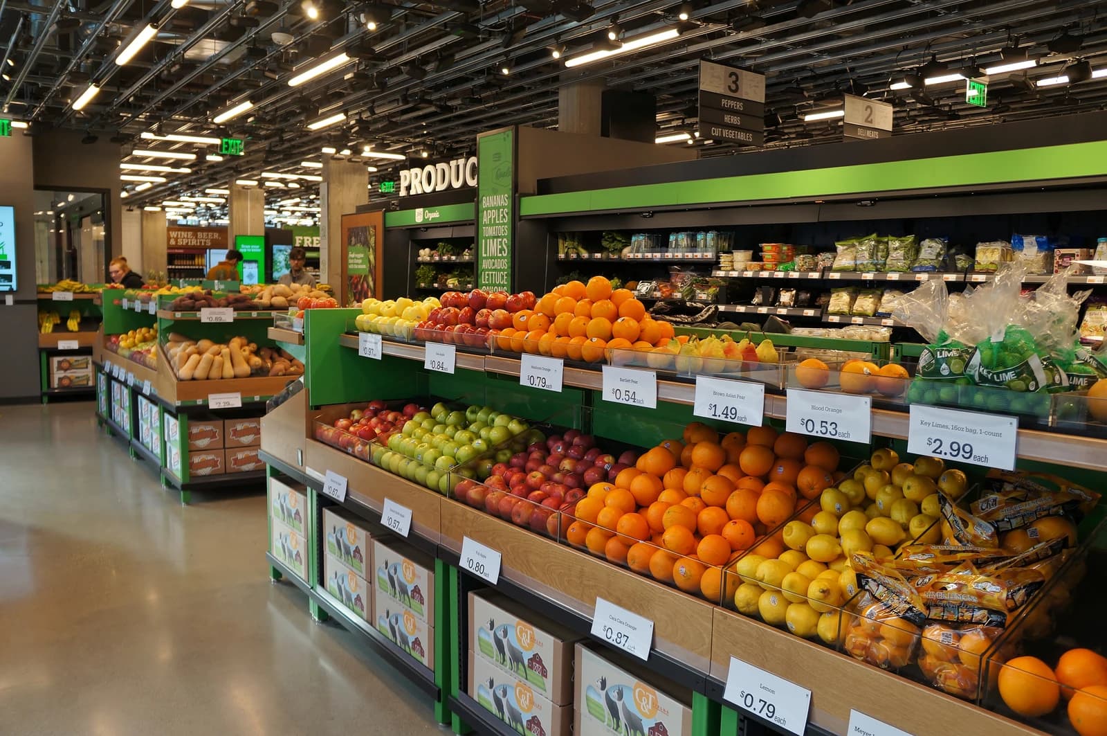 Produce section of an Amazon Go Grocery store with various fruits and vegetables displayed.