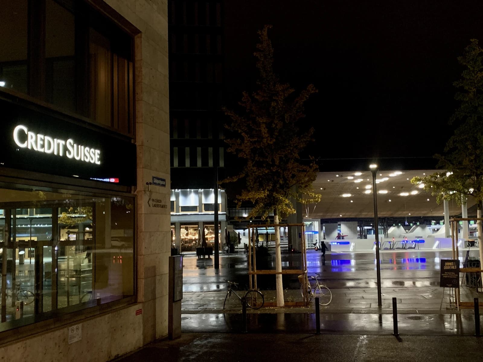 Credit Suisse office building illuminated at night in Zurich, Switzerland.