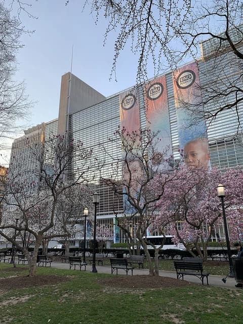 World Bank Group headquarters building with banners depicting 'END POVERTY' and trees in the foreground.