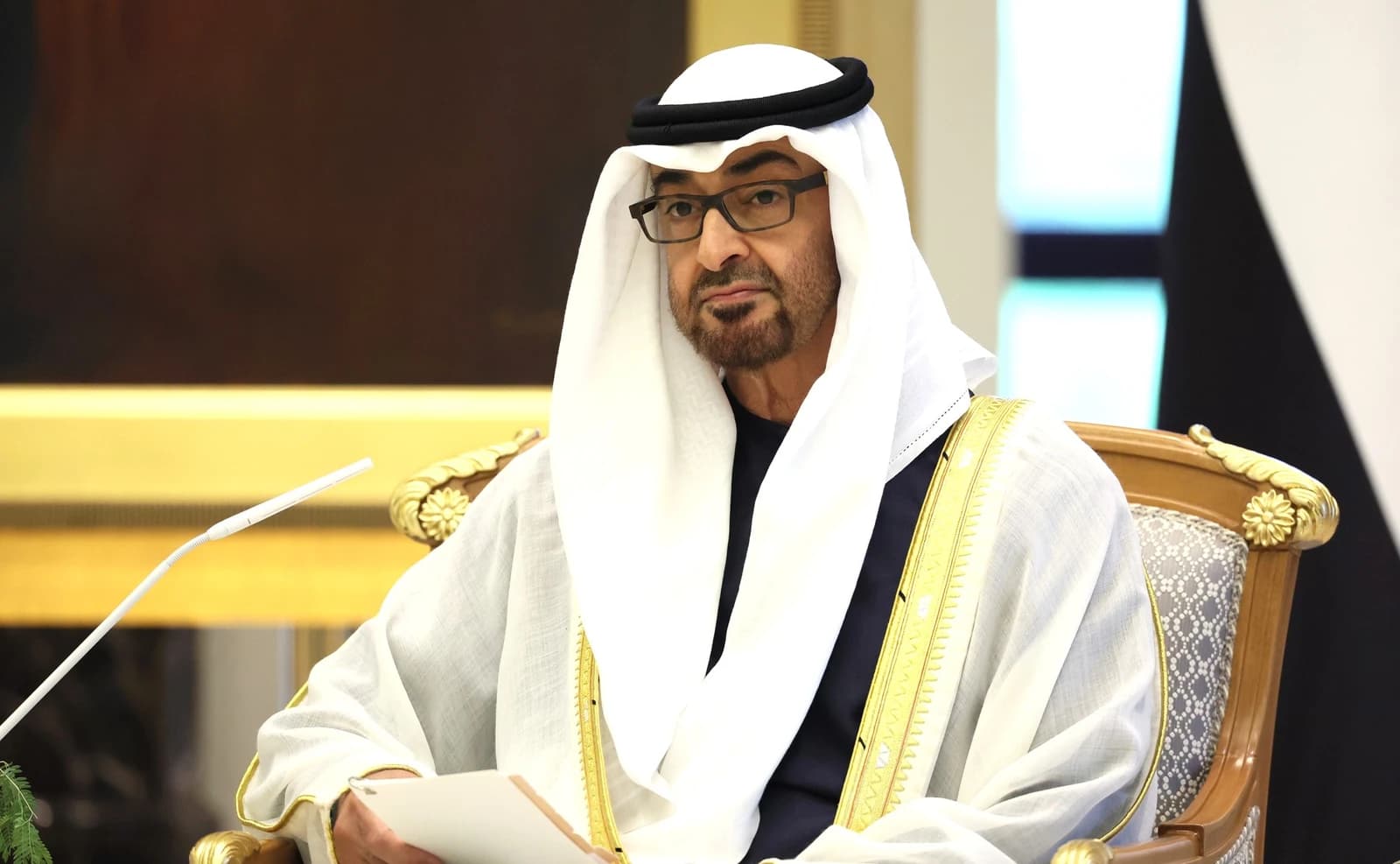 Sheikh Mohammed bin Zayed Al Nahyan, President of the UAE, seated indoors.