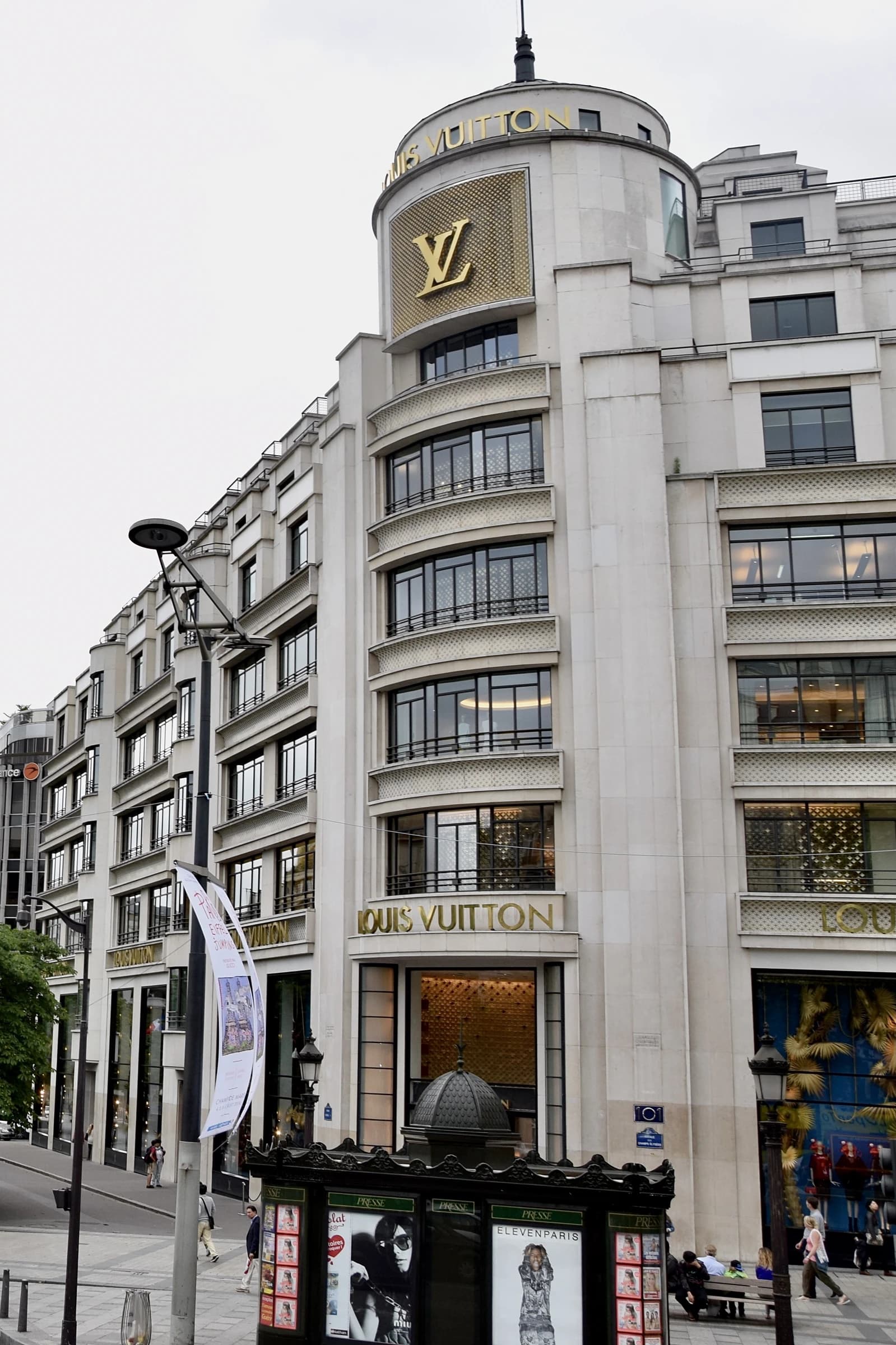 Louis Vuitton headquarters building in Paris, France, under a cloudy sky.