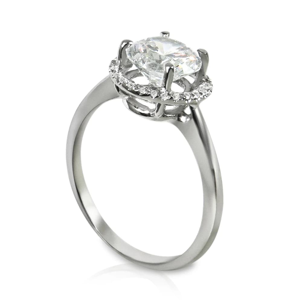 Diamond engagement ring with a round center stone and diamond halo.