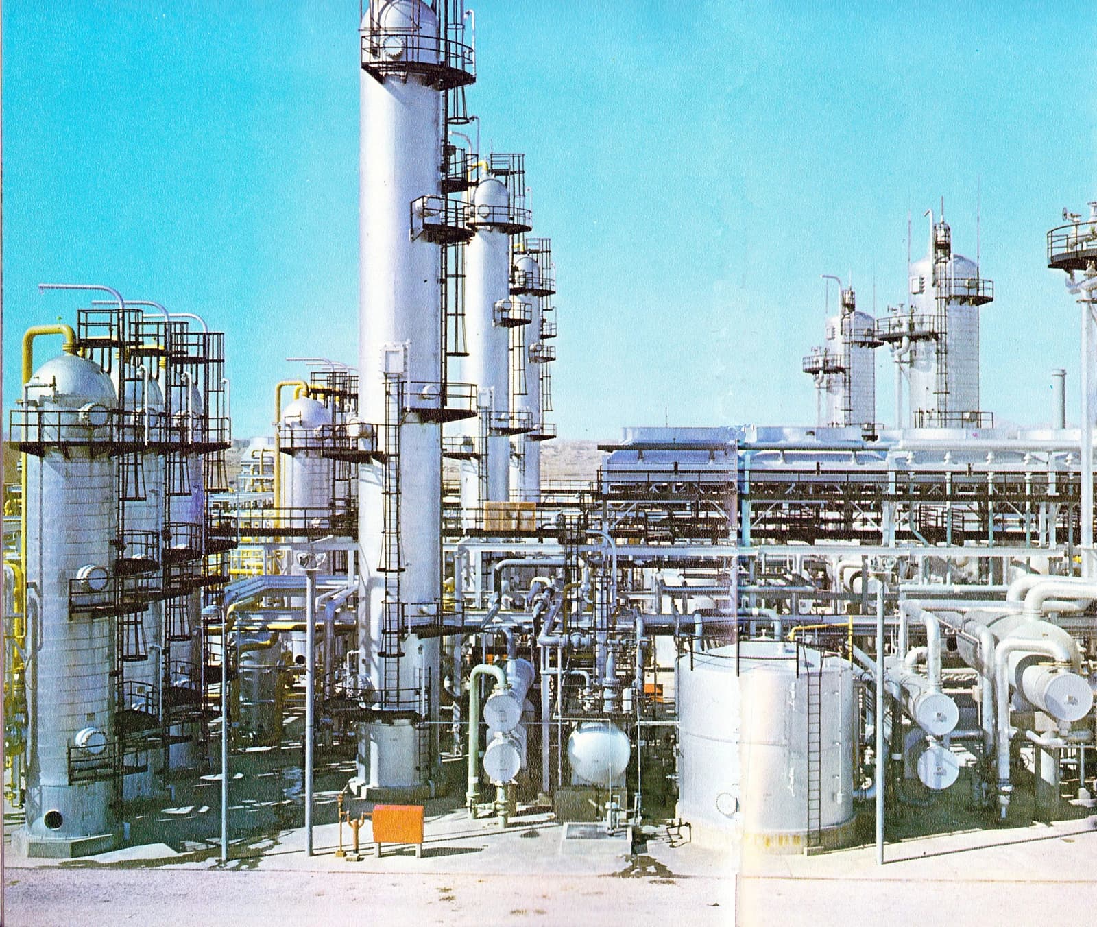 Bidboland gas refinery showing large industrial processing towers and pipes.