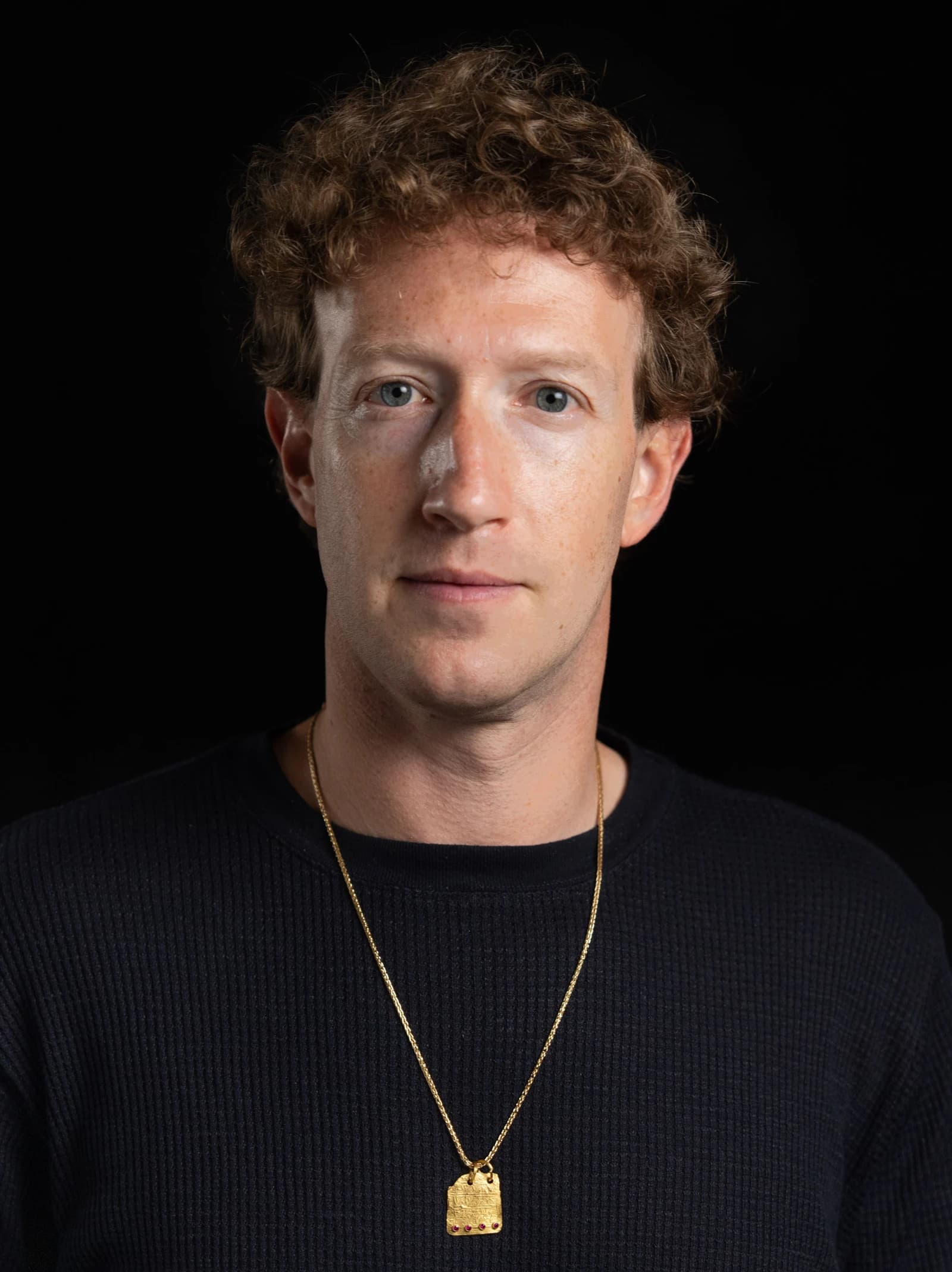 Mark Zuckerberg, CEO of Meta, looking directly at the camera with a black background.