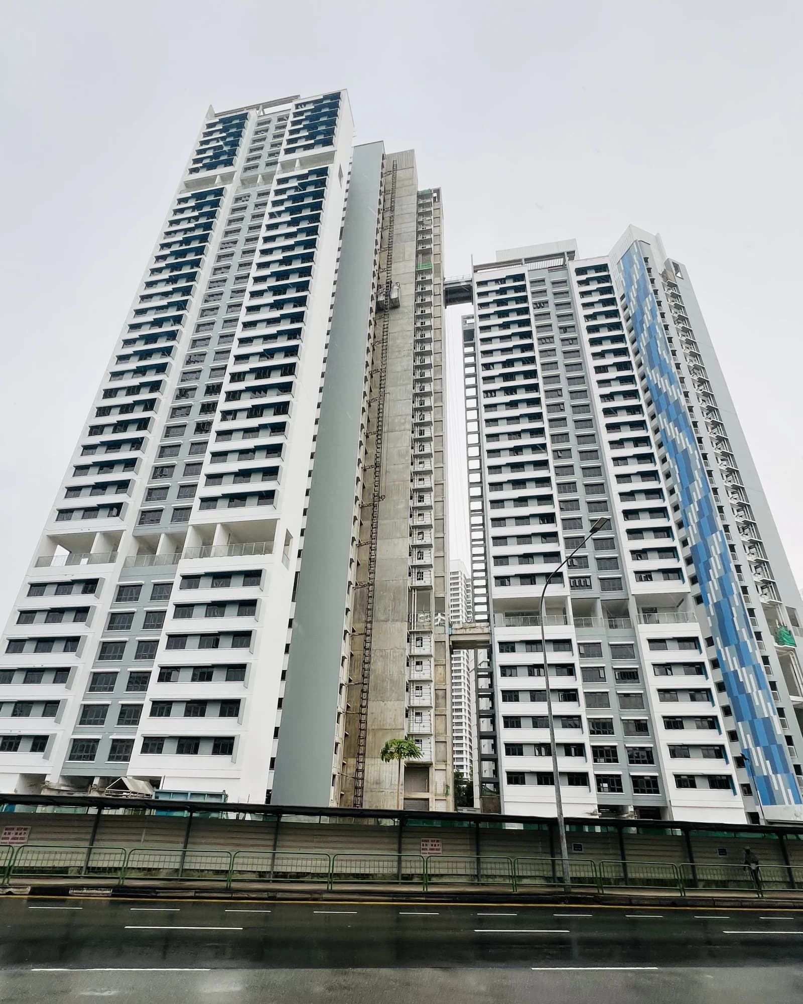 Tall residential buildings under construction dominate the sky in Singapore.