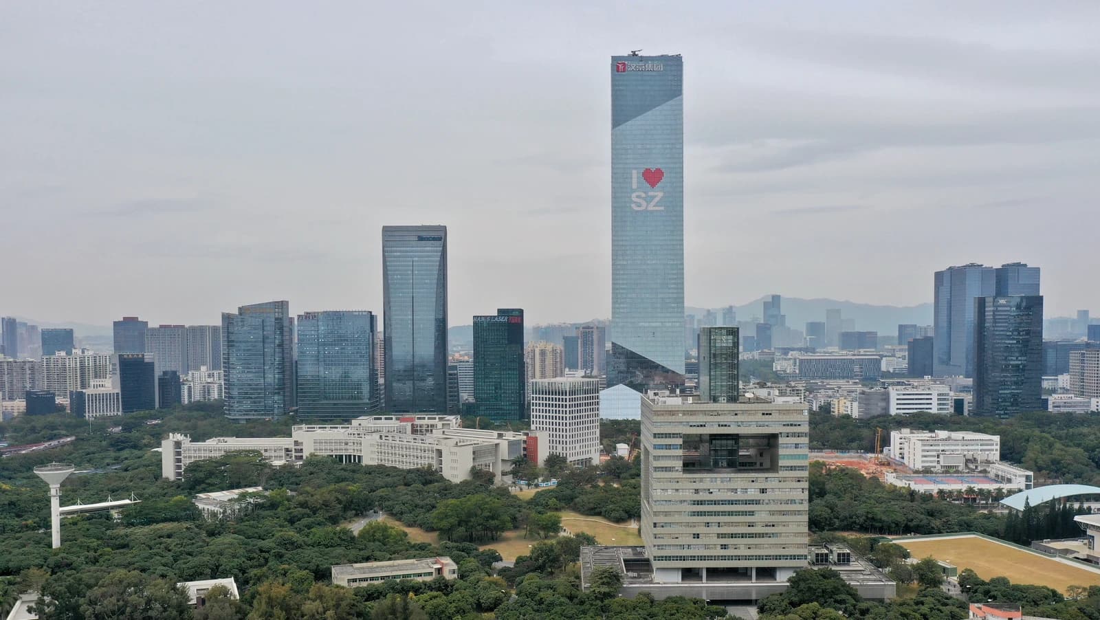 Tencent Tower and Hanking Center skyscrapers standing among other buildings in Shenzhen, China.