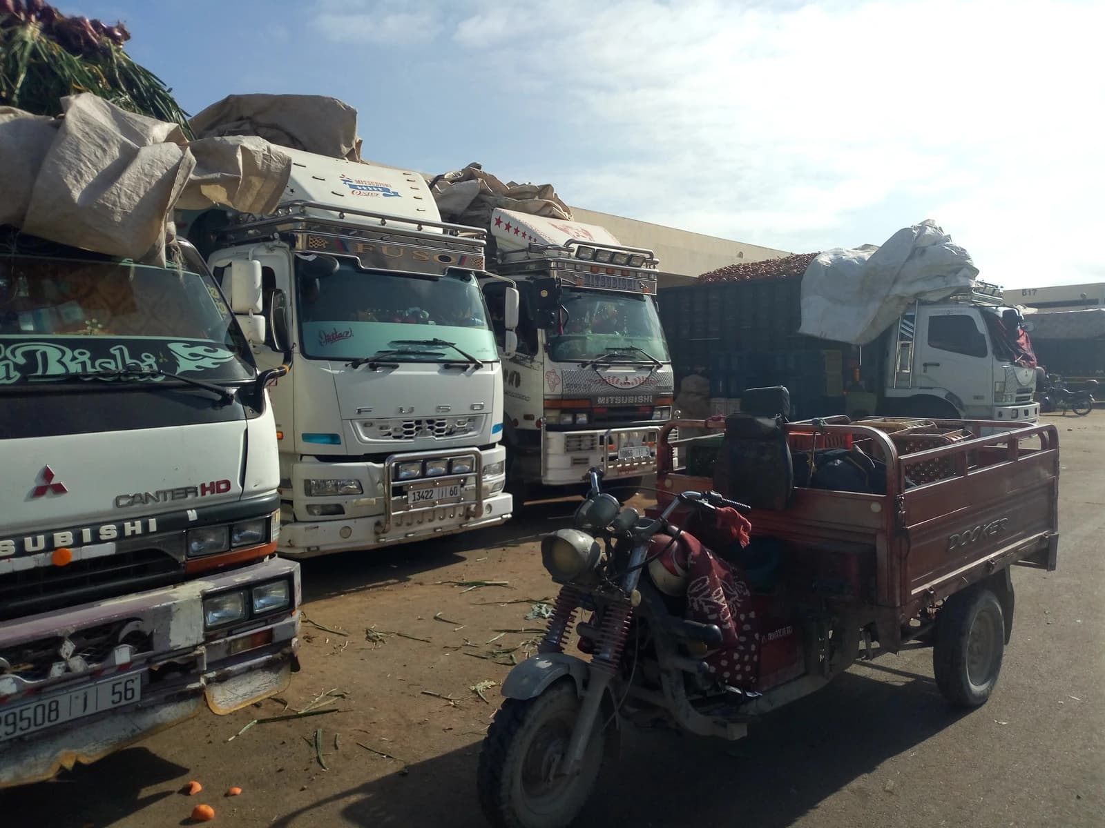 Trucks loaded with vegetables and fresh fruits parked at the Inezgane wholesale market.