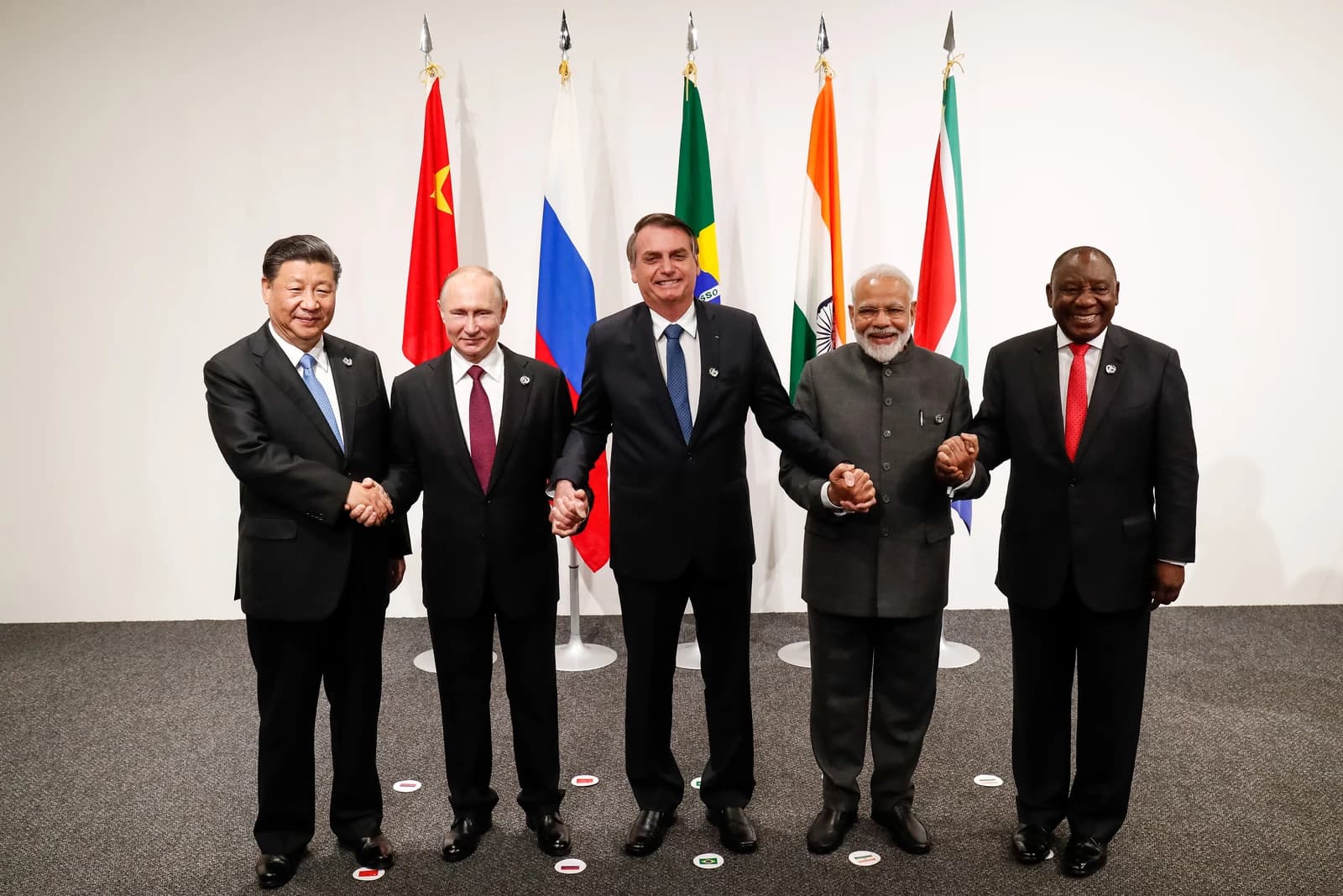 BRICS leaders including Xi Jinping, Vladimir Putin, Jair Bolsonaro, Narendra Modi, and Cyril Ramaphosa pose.