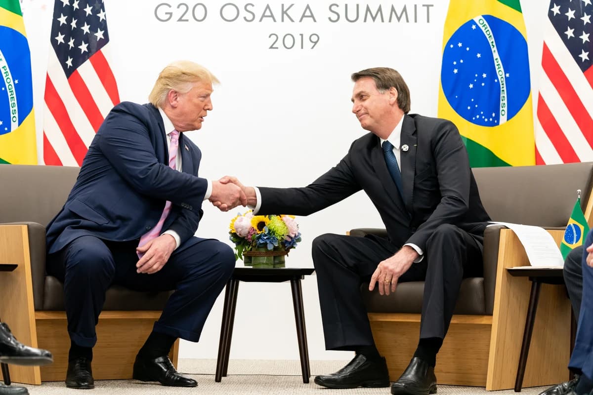 Donald Trump, President of the United States, shakes hands with Jair Bolsonaro, President of Brazil.