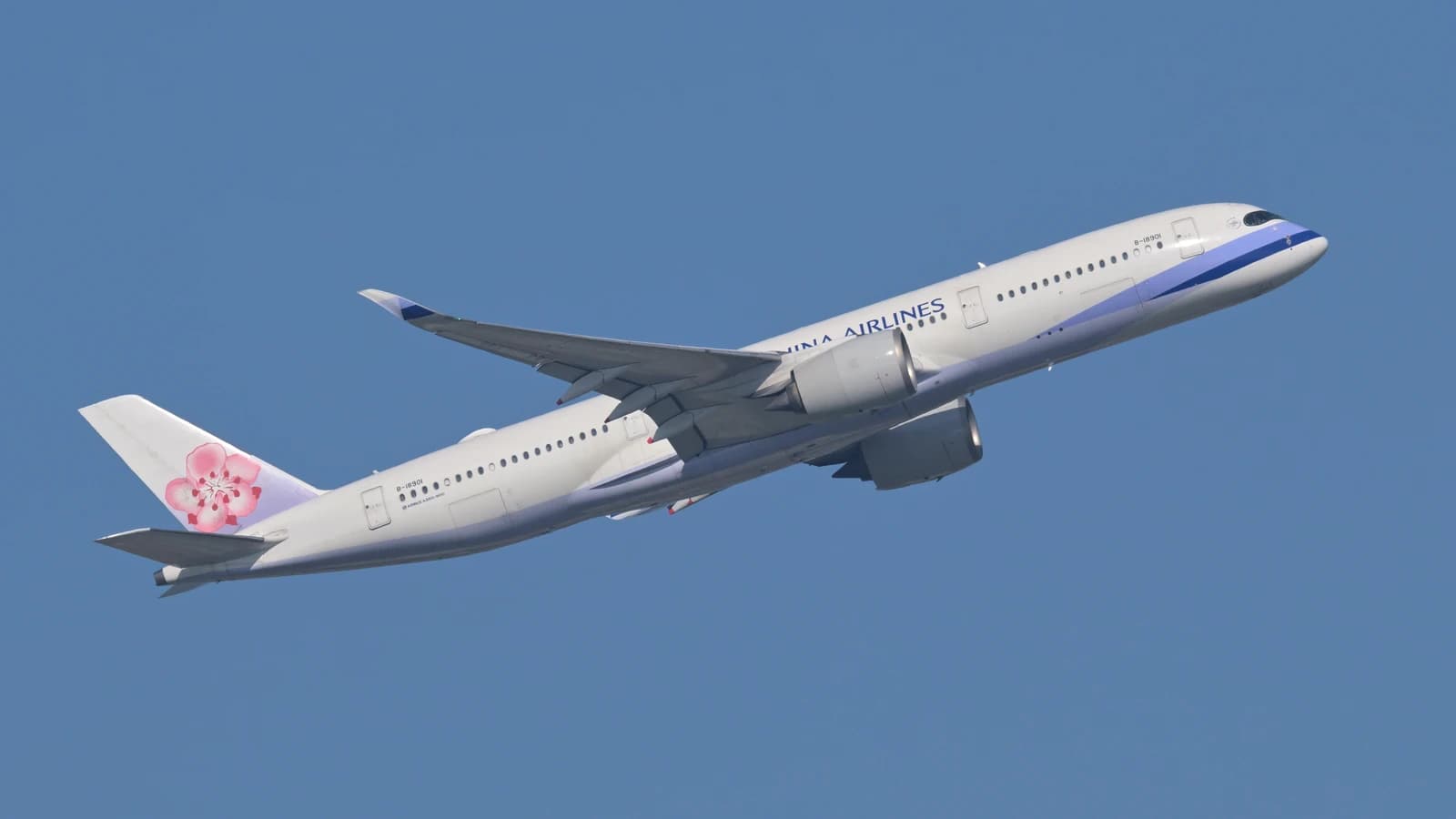 China Airlines Airbus A350-900 aircraft taking off against a clear blue sky.