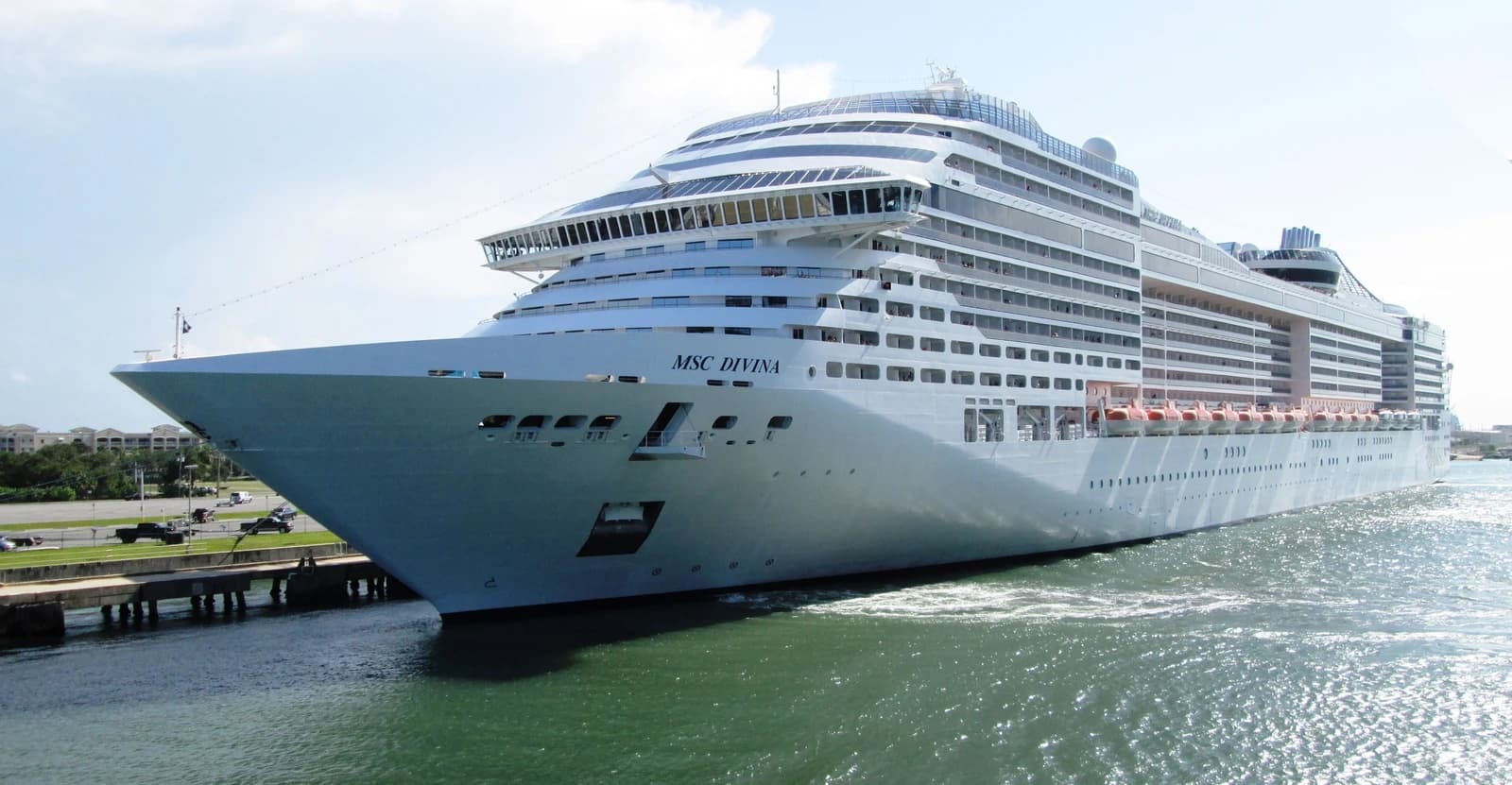 Large white cruise ship MSC Divina departing from Port Canaveral, Florida.