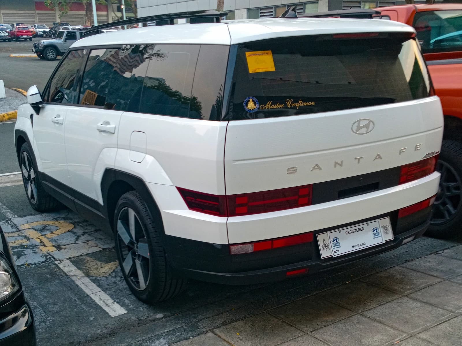 Rear left view of a white 2024 Hyundai Santa Fe 2.5 GLS AWD.