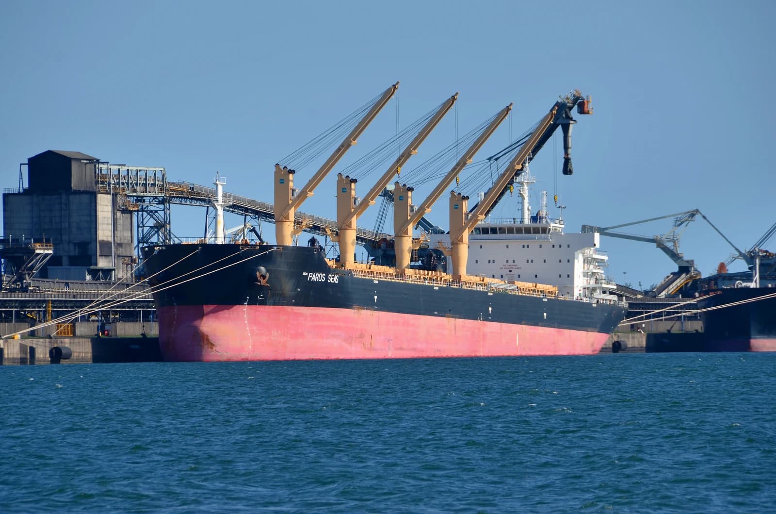 Bulk carrier ship "PAROS SEAS" docked at Richards Bay Coal Terminal in South Africa.