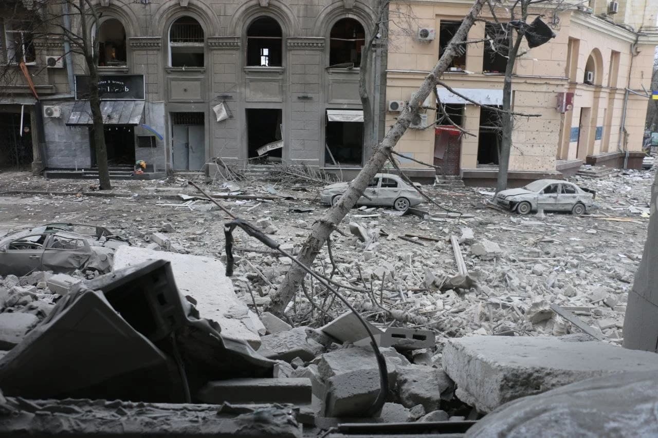 Kharkiv downtown street covered in rubble and debris from a Russian bombardment.