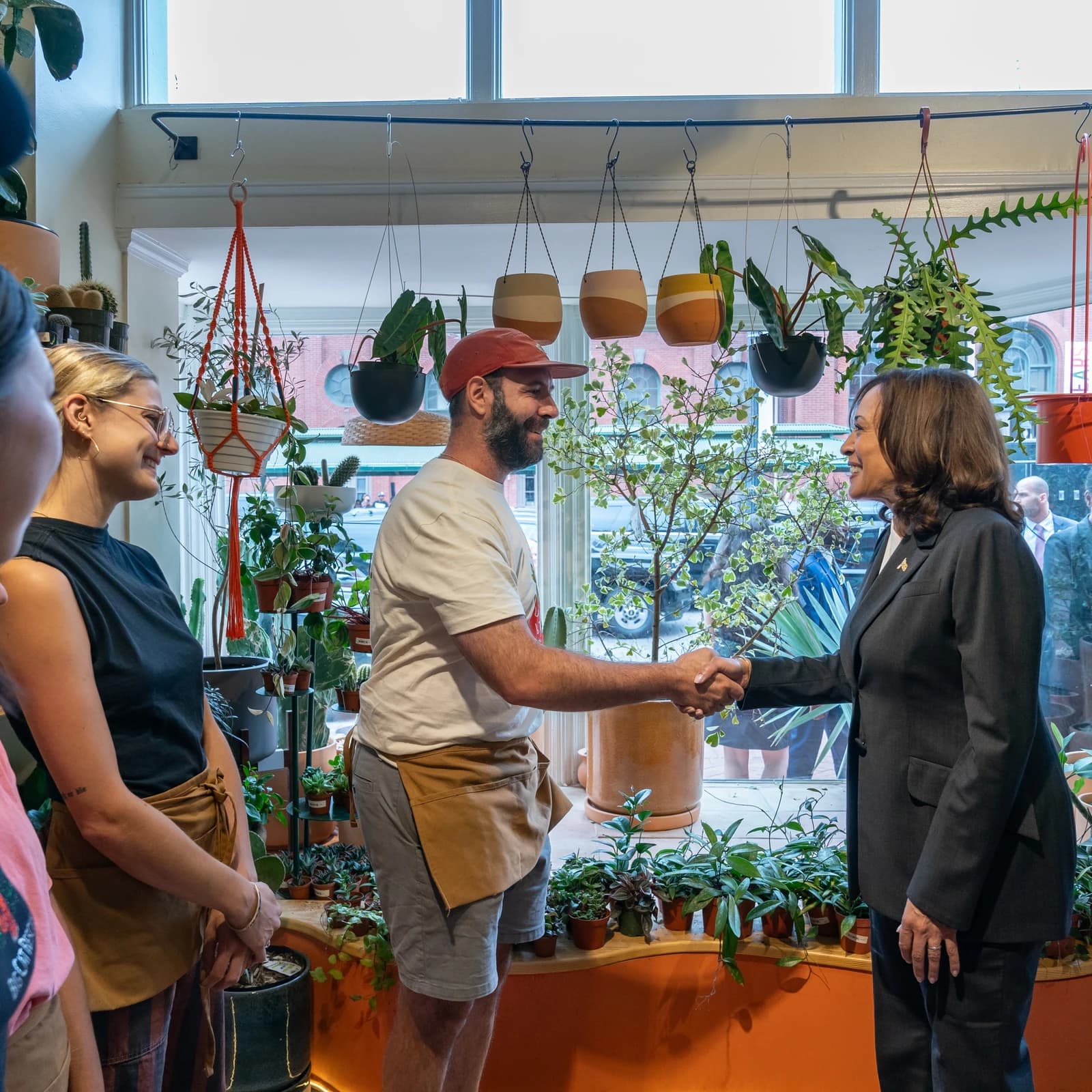 Kamala Harris, Vice President of the United States, shaking hands with a man.