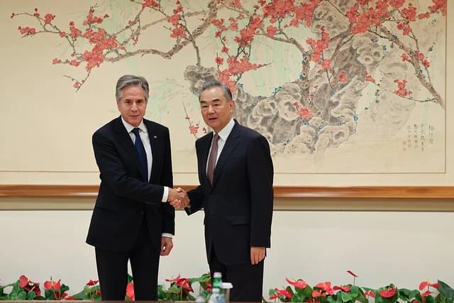 US Secretary of State Antony Blinken shaking hands with Chinese Foreign Minister Wang Yi.