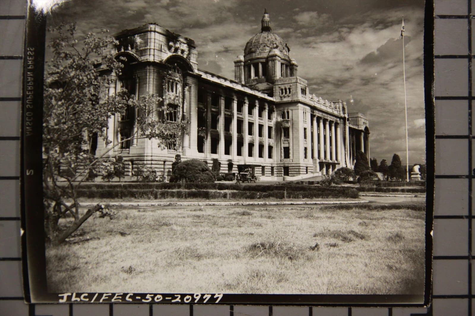 Central Government Building in Korea with damaged facade and missing windows.