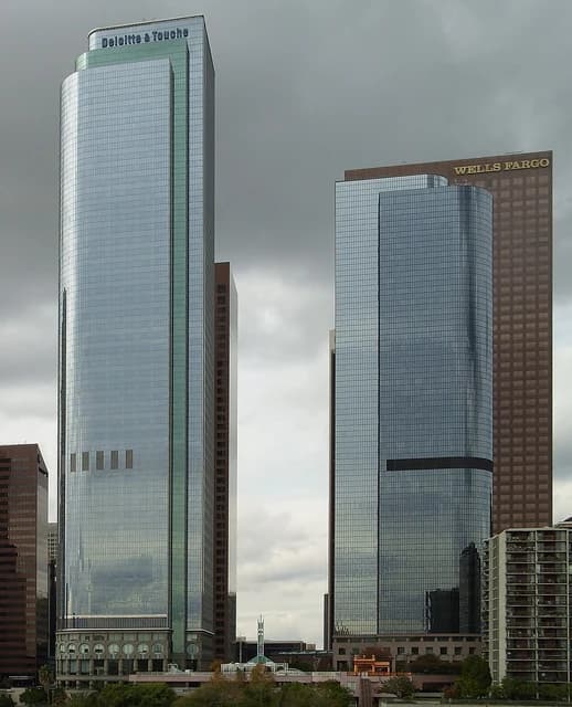 Skyscrapers with Wells Fargo signage and Deloitte & Touche signage in downtown Los Angeles.