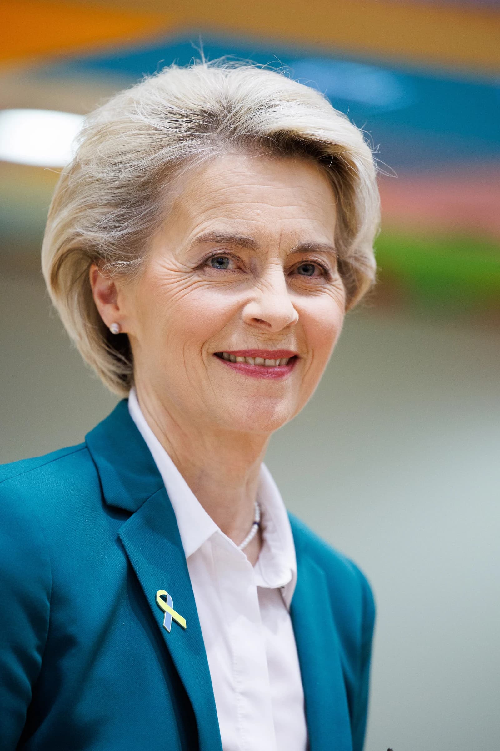 Ursula von der Leyen, President of the European Commission, smiling during a European Council meeting.