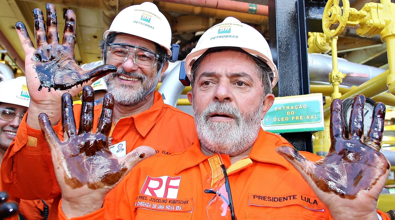 Luiz Inácio Lula da Silva, former President of Brazil, with hands covered in oil.
