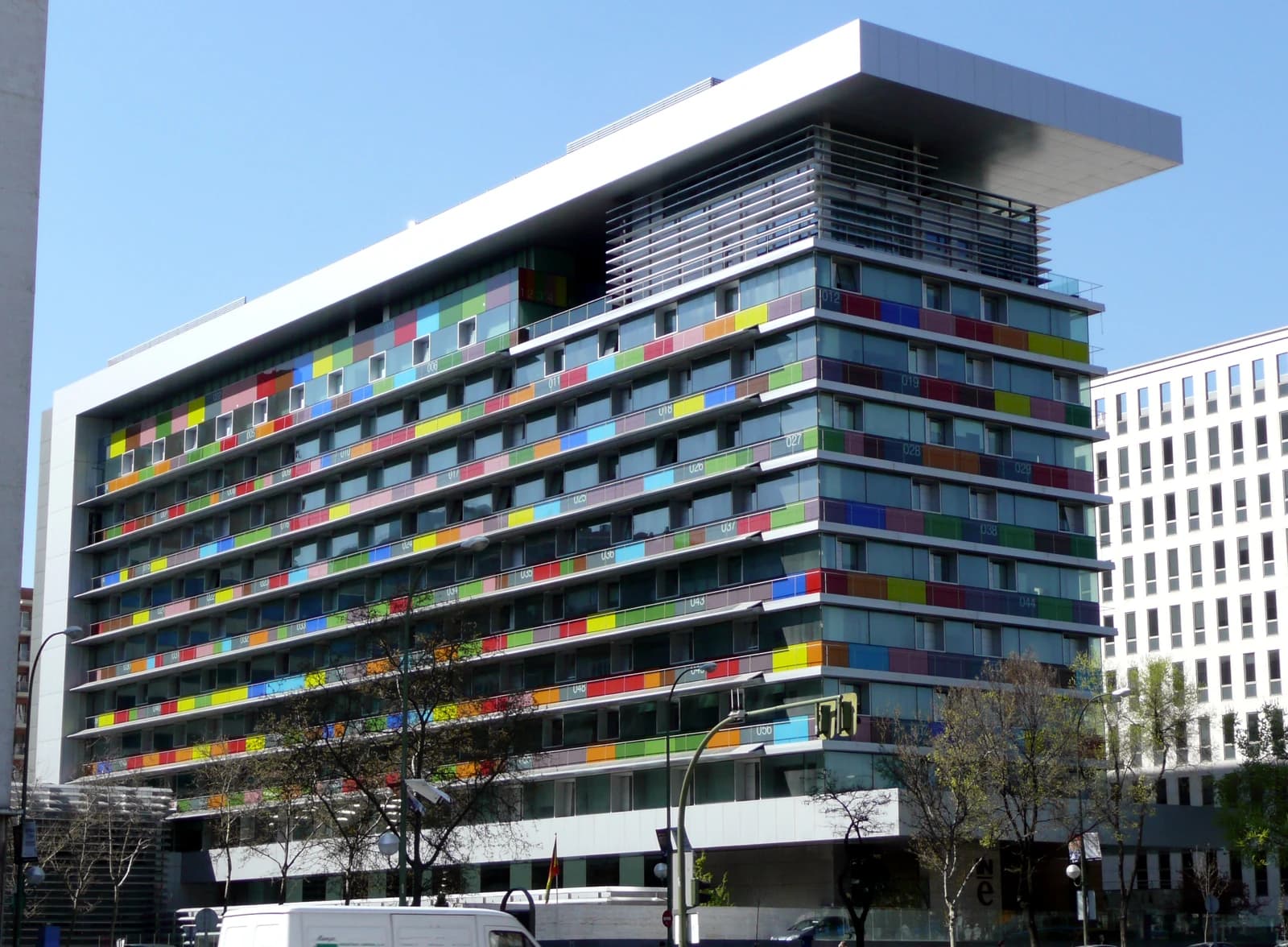 Multicolor glass facade of the National Institute of Statistics building in Madrid.