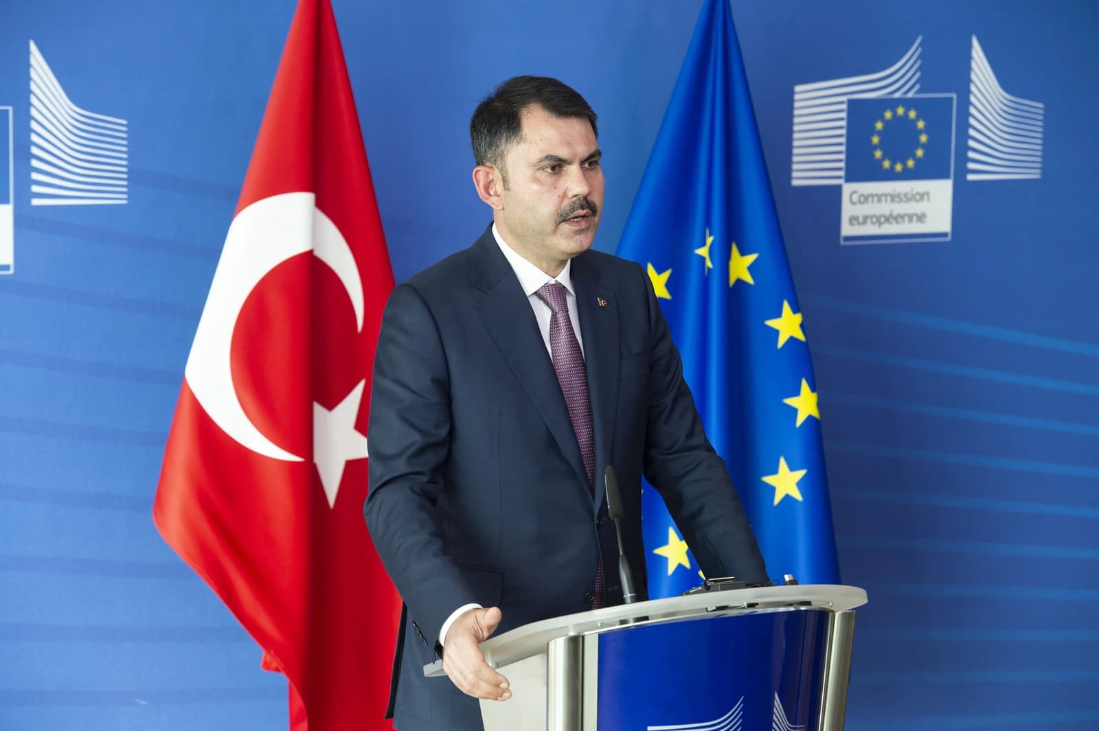 Murat Kurum, Turkish Minister for Environment and Urban Planning, speaking at a podium.