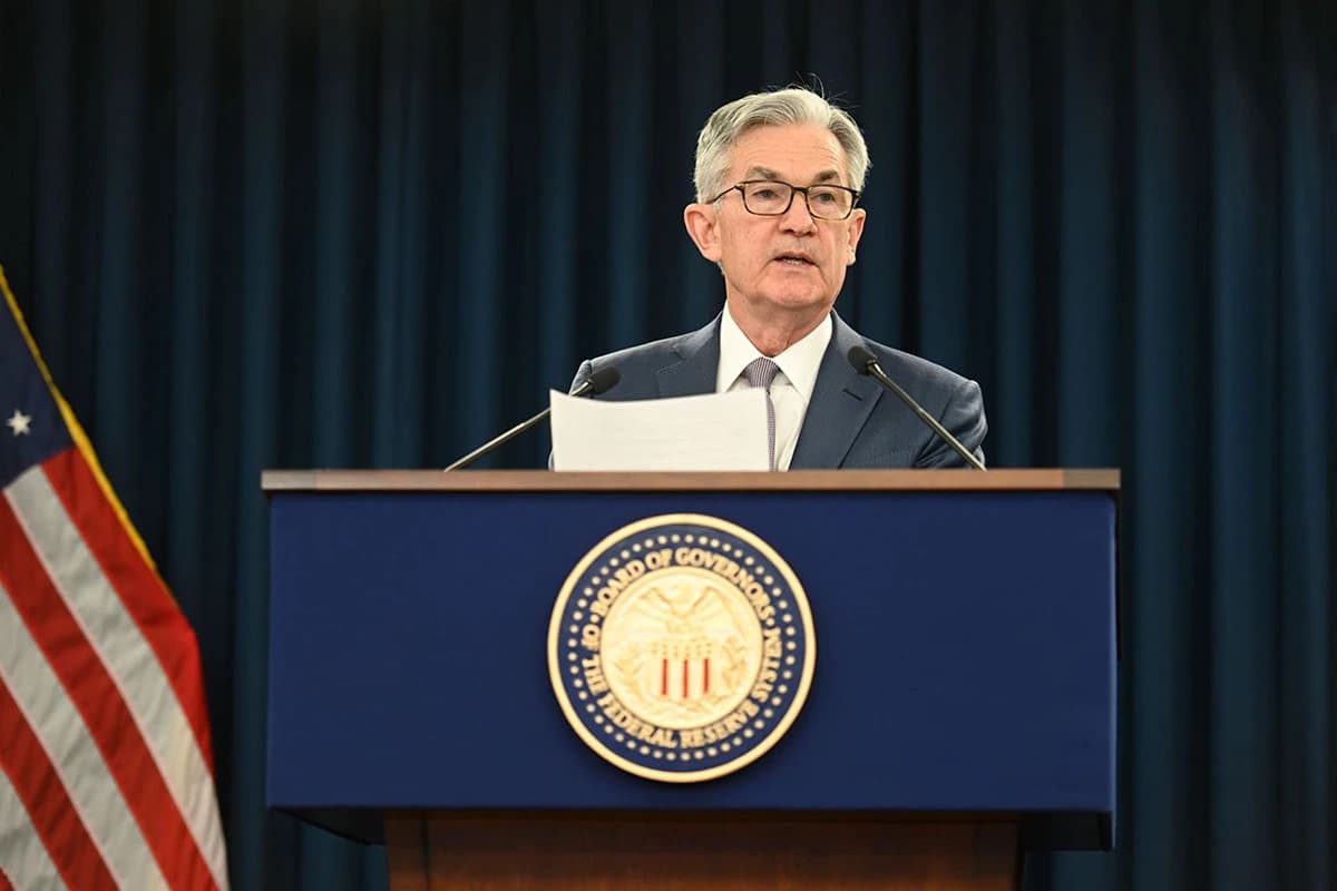 Jerome Powell, Chair of the Federal Reserve, speaking at a podium.