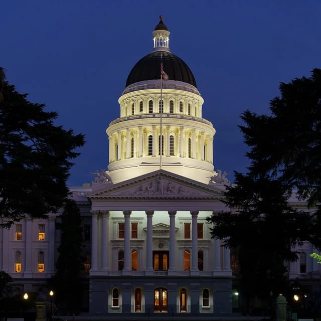 California State Capitol building in Sacramento illuminated at blue hour.