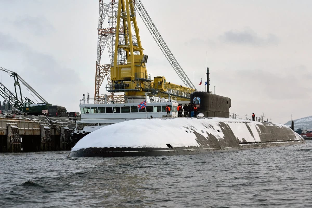 Russian Navy Borei-class strategic submarine Imperator Aleksandr III docked in a snowy harbor.