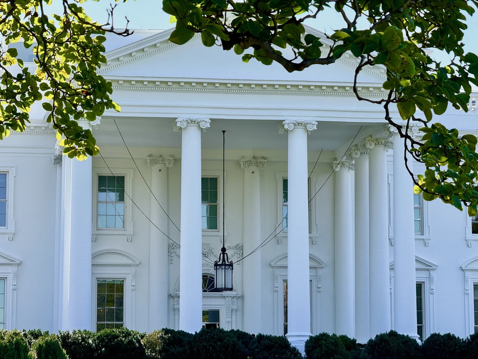 The White House North Portico with columns and windows visible.