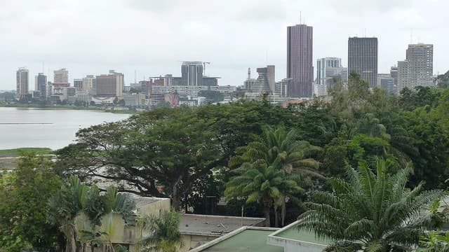 Skyline of Abidjan's business district, Plateau, with skyscrapers overlooking the Ebrié Lagoon.