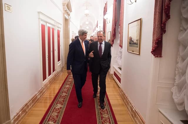 Secretary Kerry and Russian Foreign Minister Lavrov walk through the halls of the Kremlin.