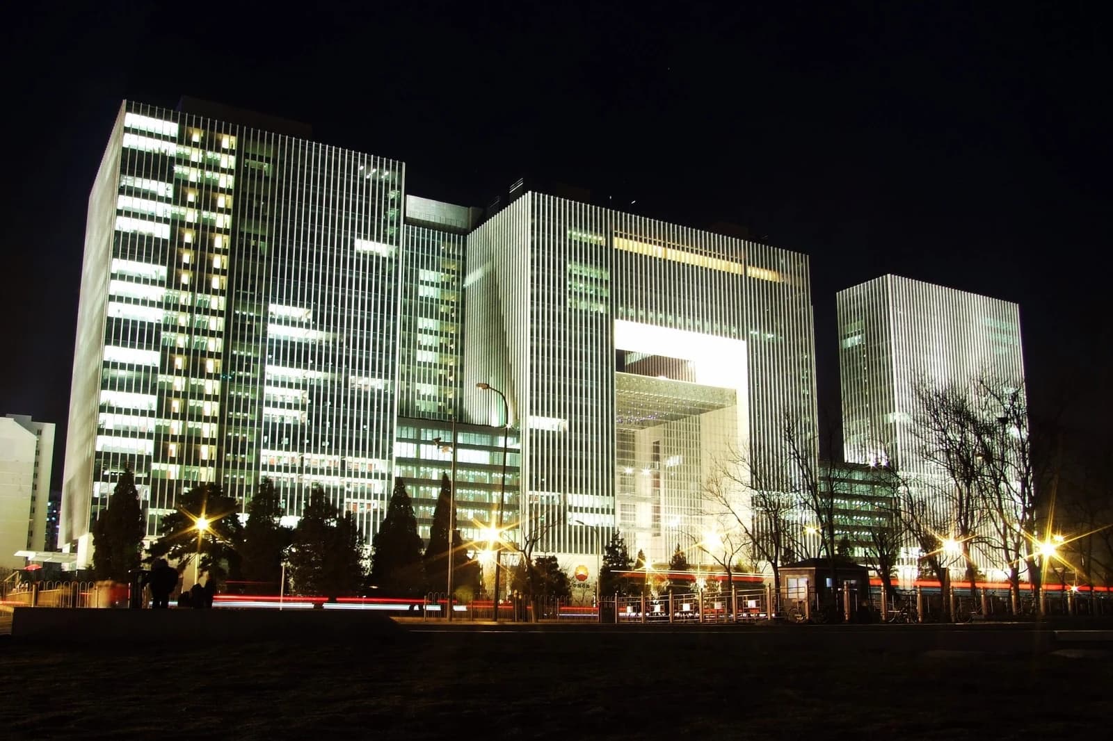 PetroChina headquarters building illuminated at night in Beijing, China.