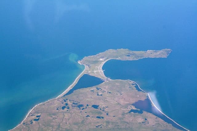 Aerial view showing the island of Miquelon connected by a tombolo.
