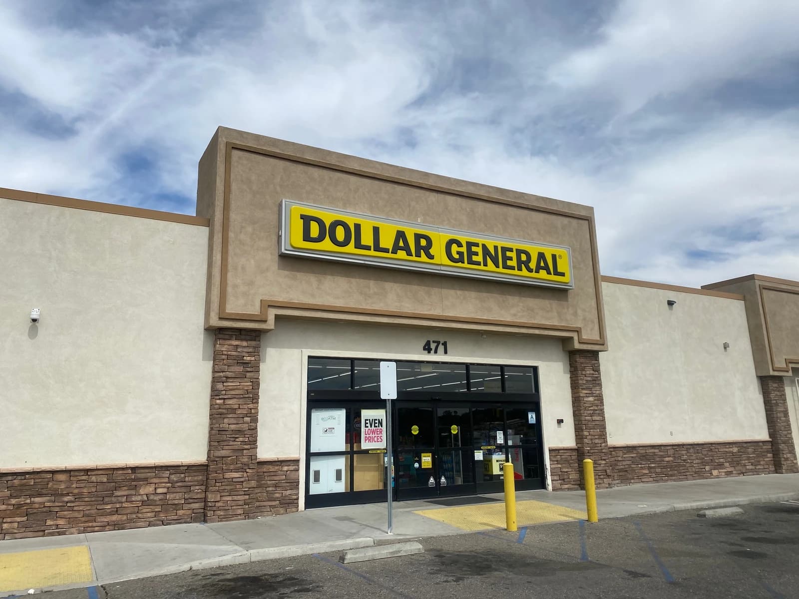 Exterior of a Dollar General store building with its sign and main entrance.