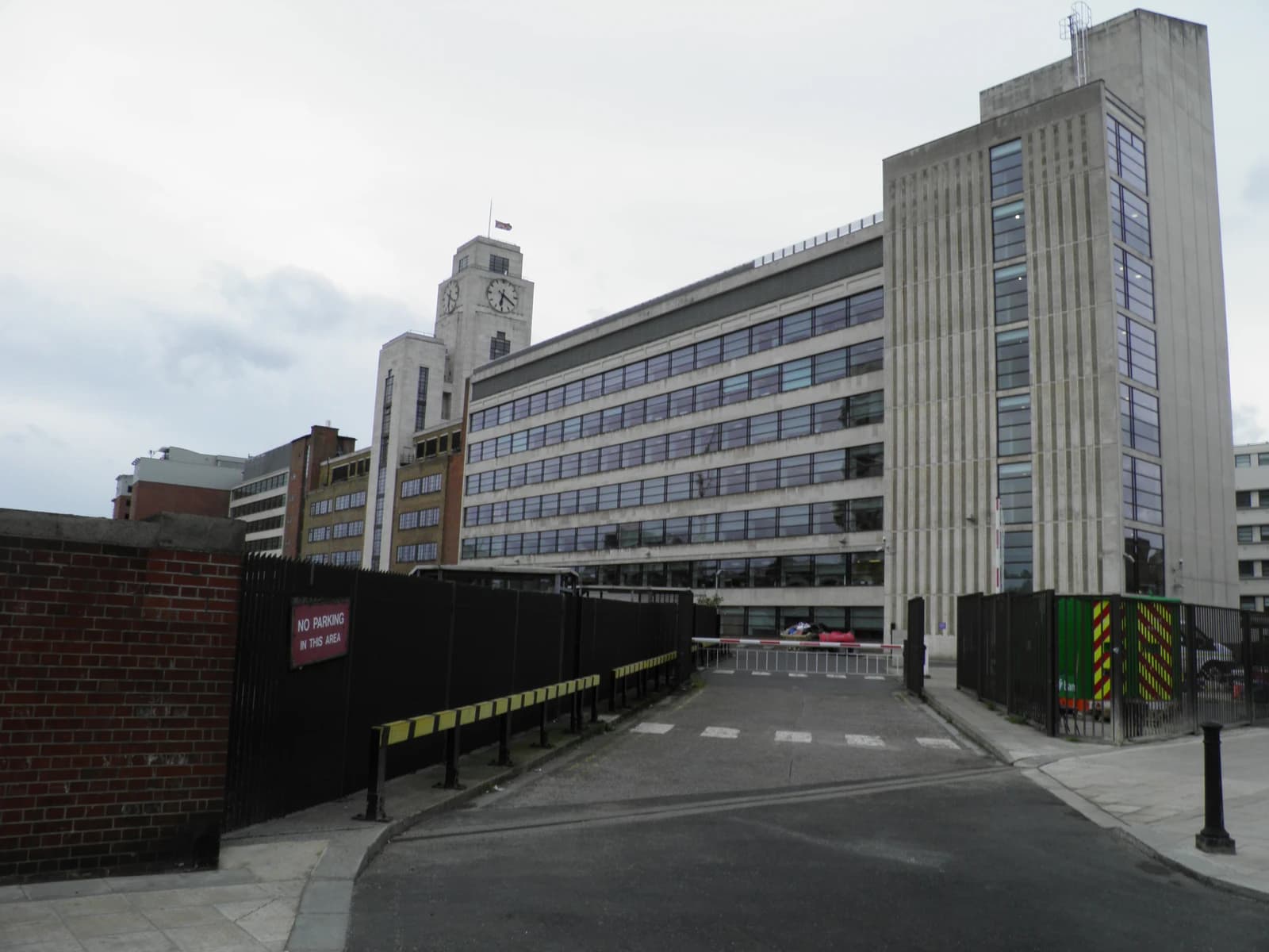 Exterior view of the National Audit Office building in London, with a clock tower visible.