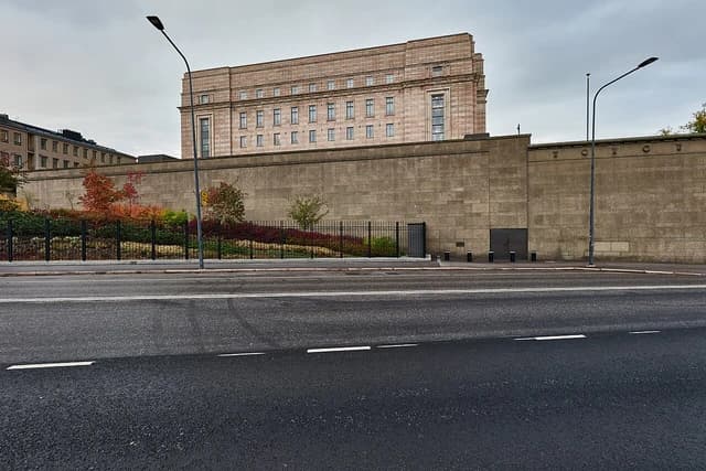 A-siipi building of the Parliament House in Helsinki from street level.