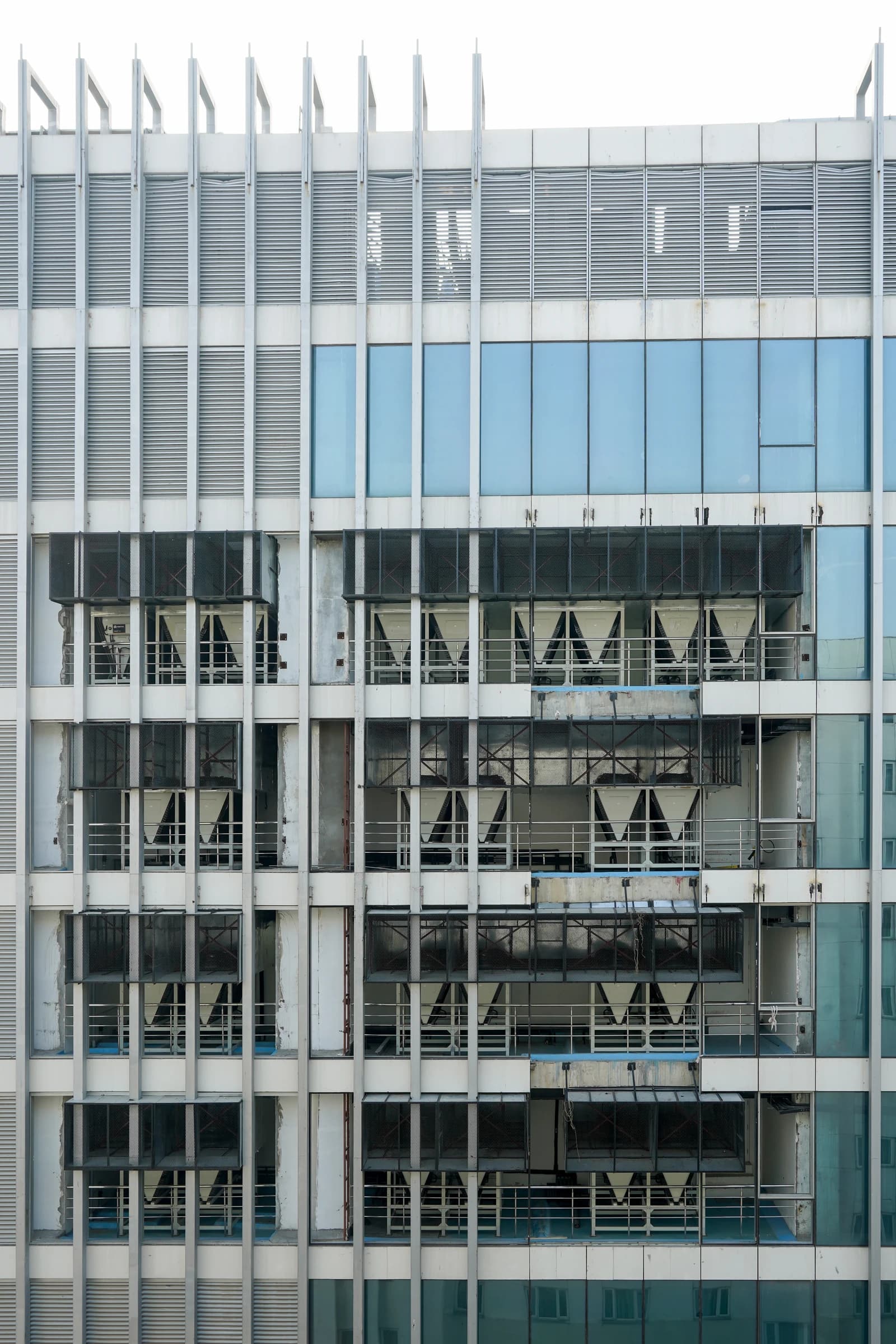 Exterior facade of a modern SIFY data center building with windows and ventilation.