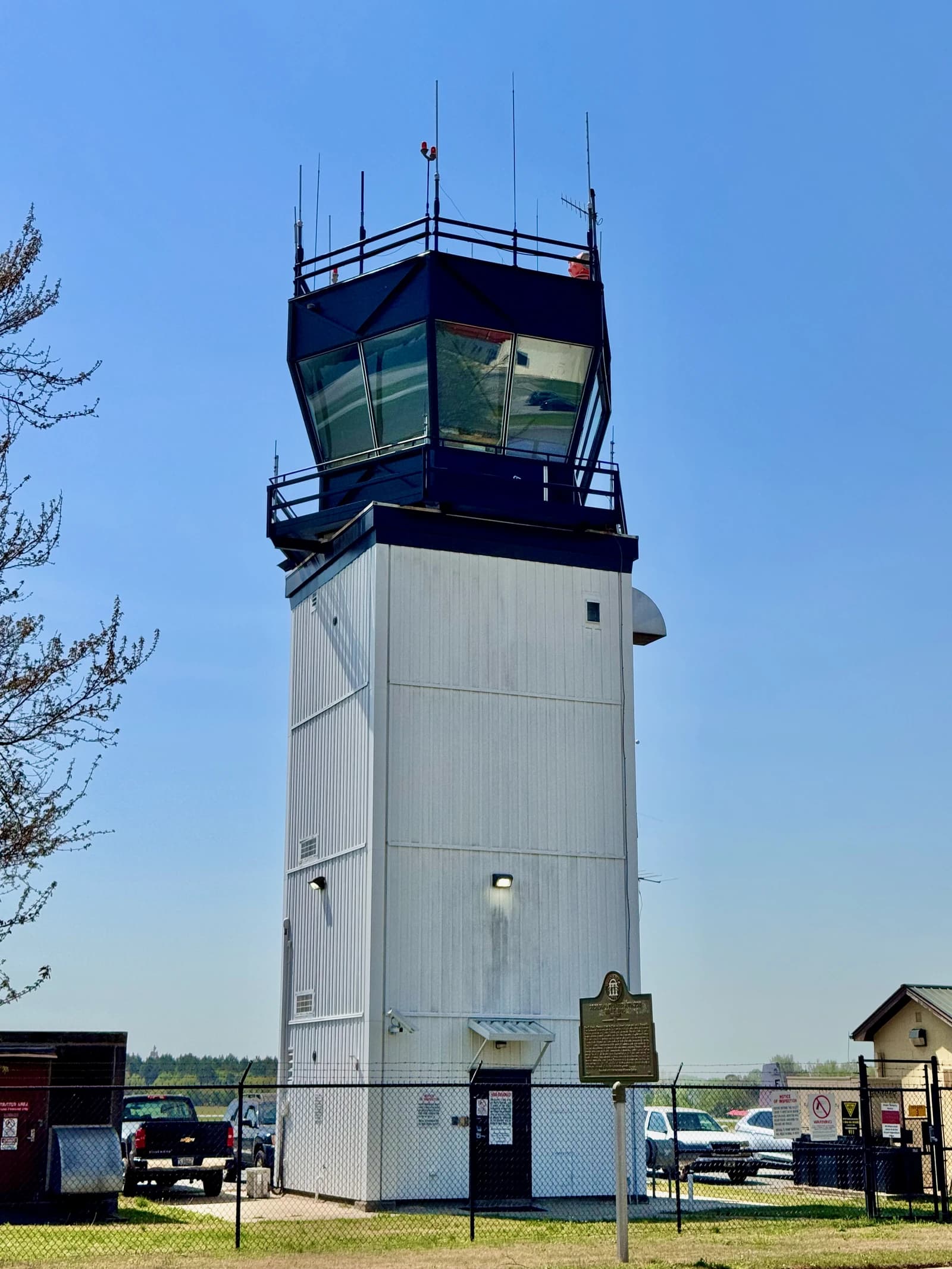 Exterior view of the Athens–Ben Epps Airport control tower under a clear blue sky.