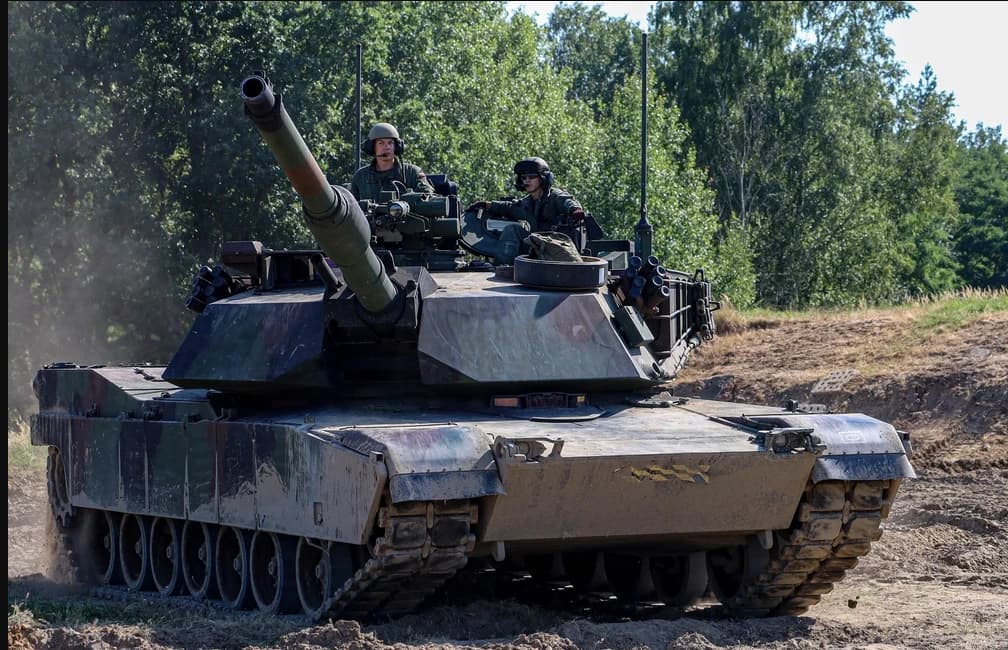 Polish Land Forces personnel operate an M1A2 Abrams Main Battle Tank during training in Poland.