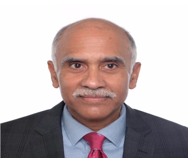 Parvathaneni Harish, diplomat, looking directly at the camera.
