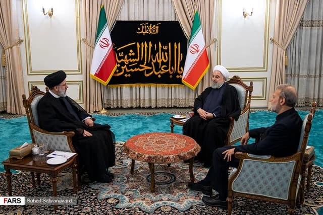 Hassan Rouhani, Ebrahim Raisi, and Ali Larijani meeting in an ornate room.