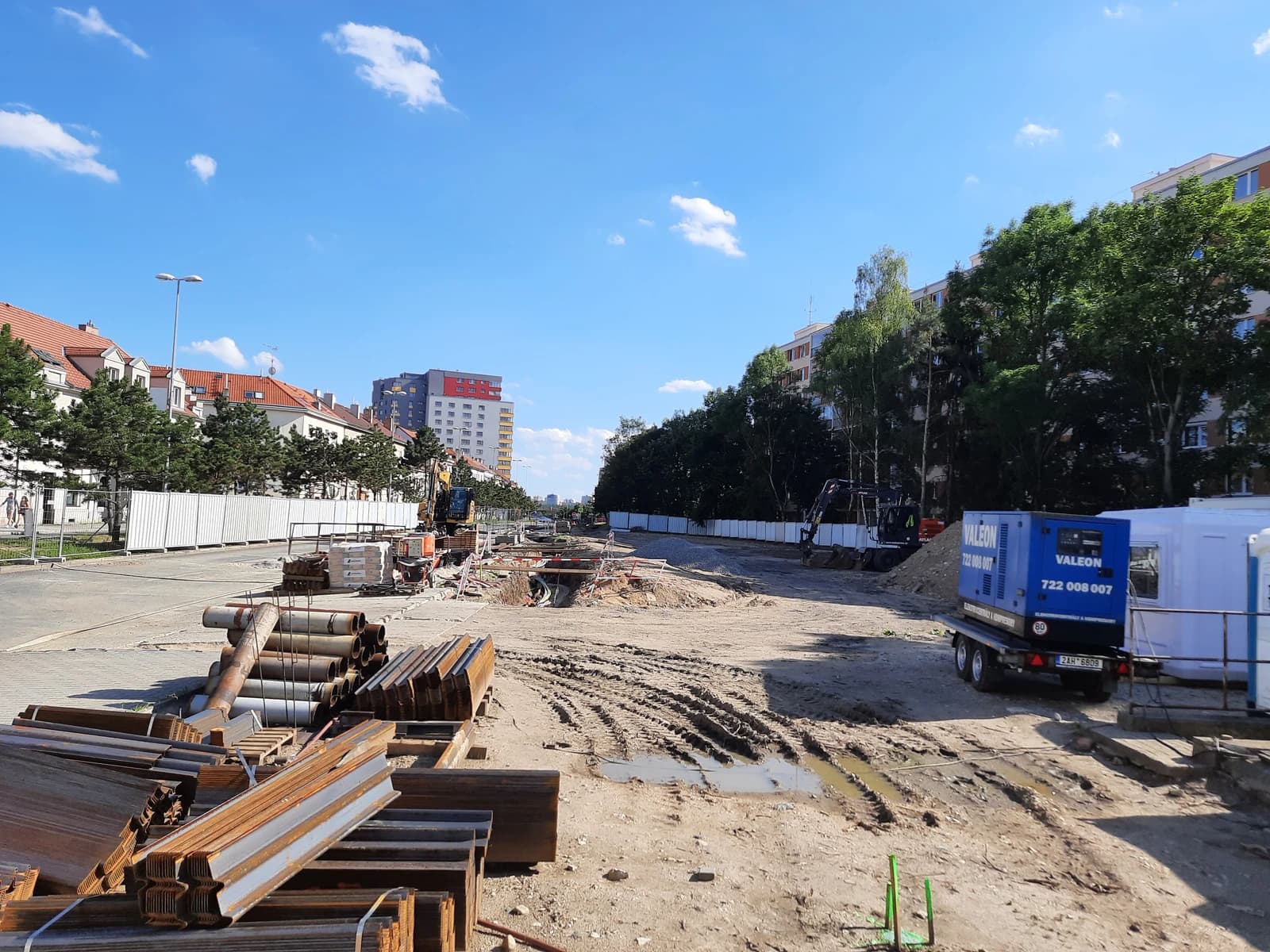 Construction site with pipes and metal beams, Prague Metro Line D in progress.