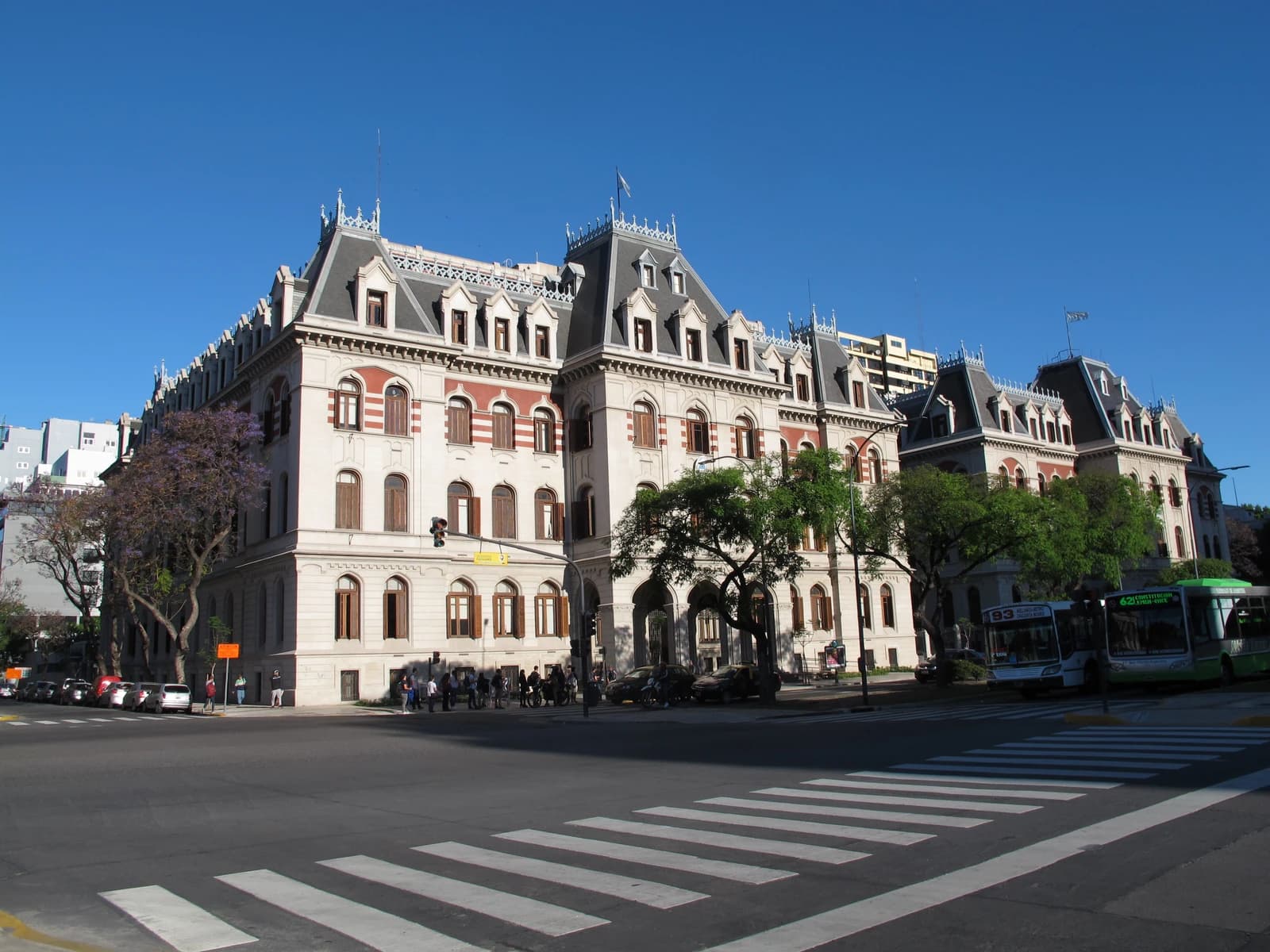 Ministry of Agriculture building in Buenos Aires with trees and crosswalk.
