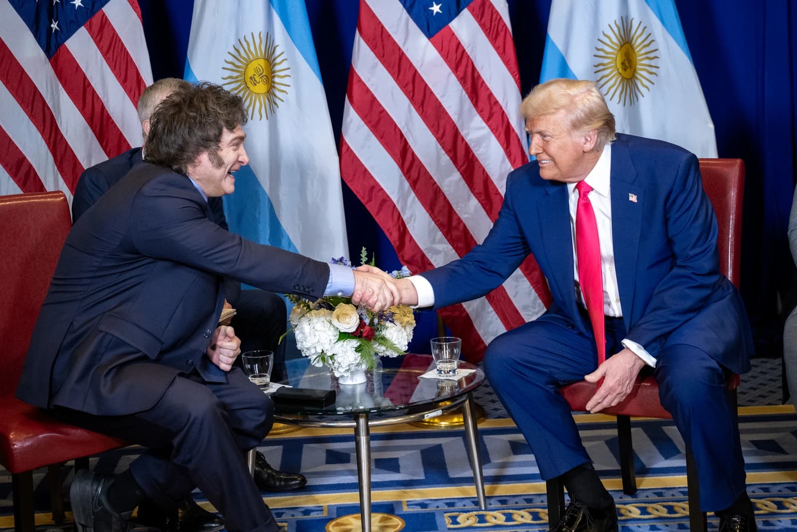 Donald Trump, former U.S. President, shaking hands with Javier Milei, President of Argentina.