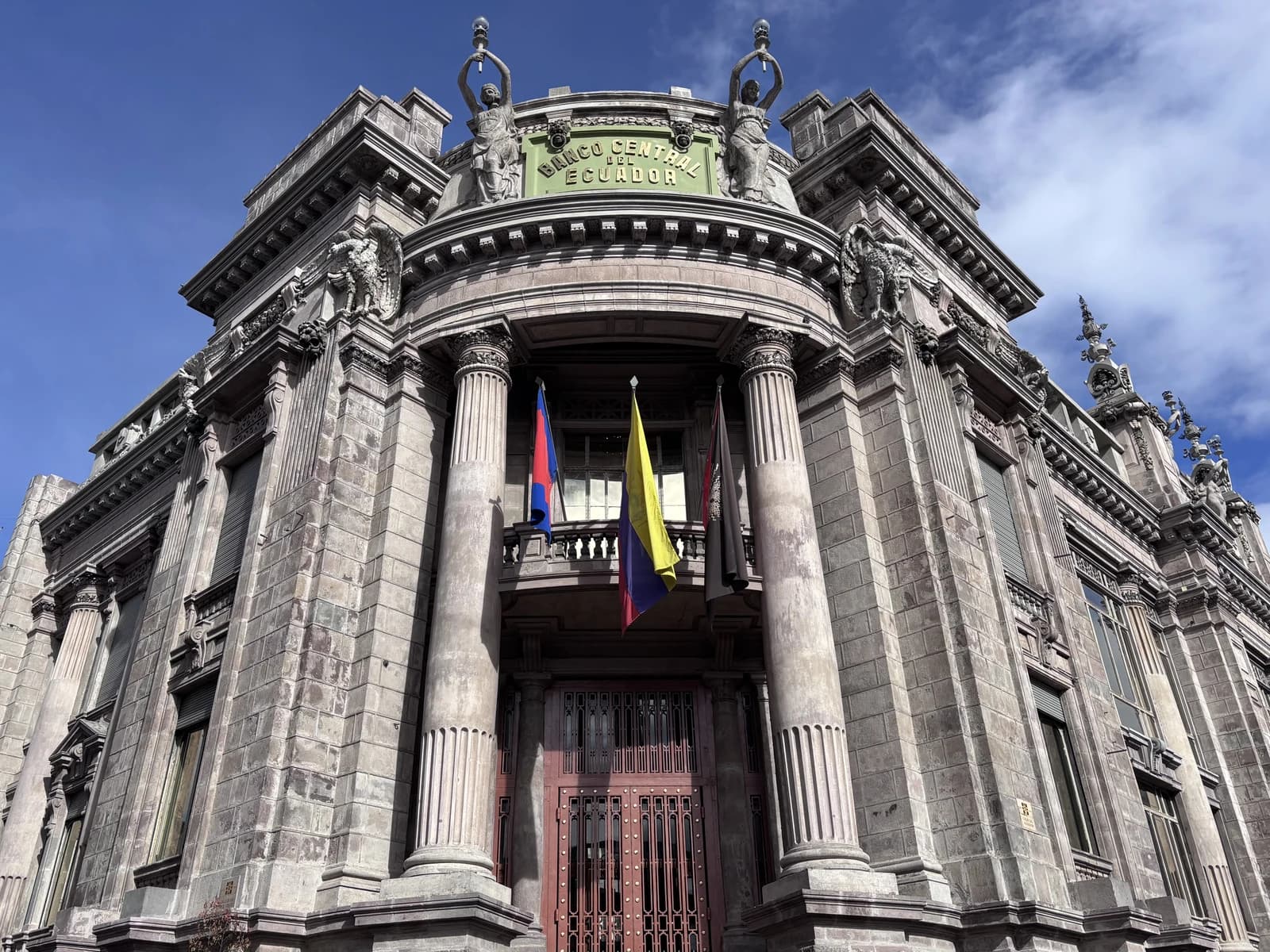 Old building of the Central Bank of Ecuador in Quito, featuring ornate stonework and columns.