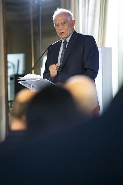 Josep Borrell, EU High Representative, speaking at a podium during a conference.